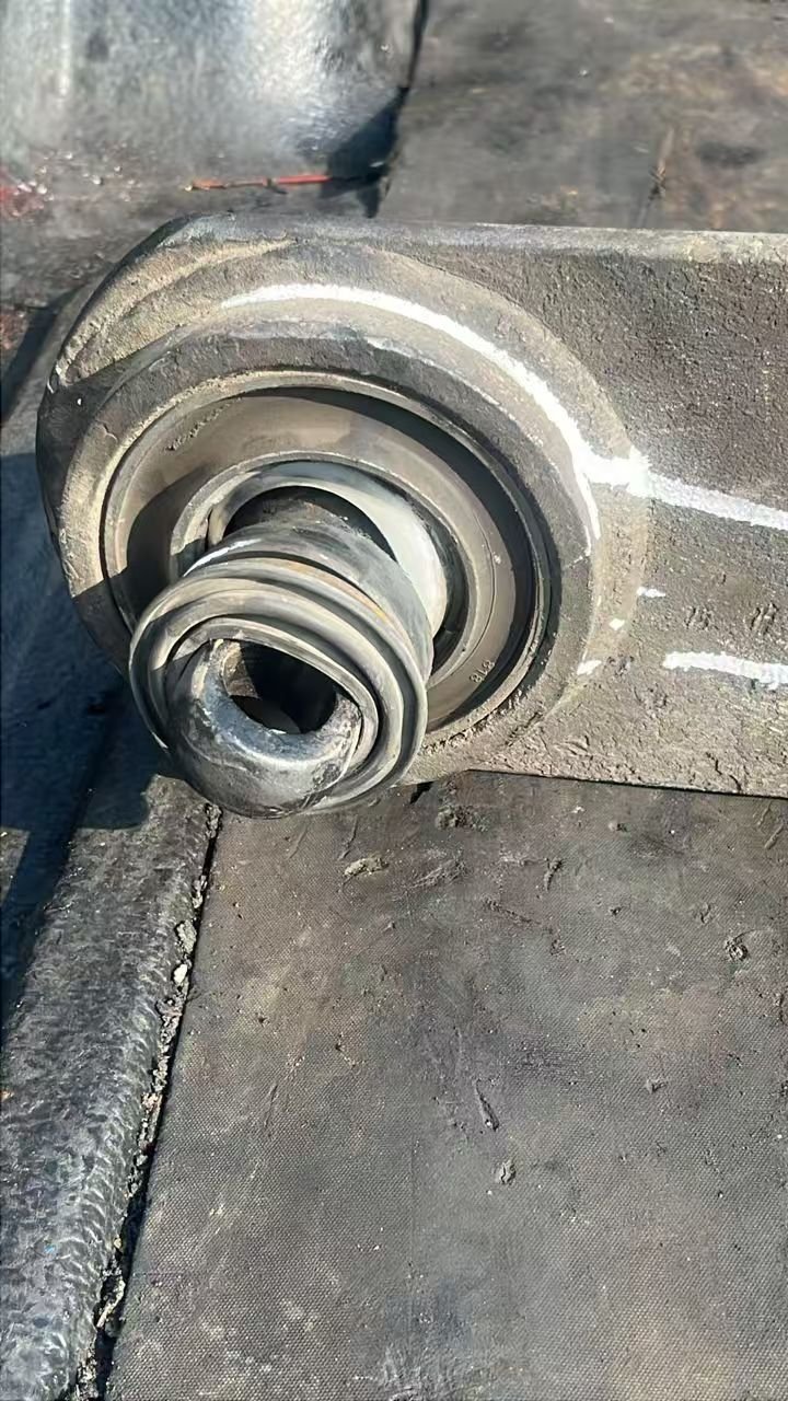 Severe rubber fatigue and cracking on a failed heavy-duty control arm bushing